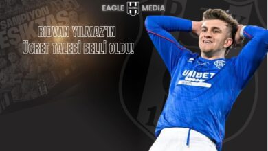 Beşiktaş’a dönüşü gündemde olan Rıdvan Yılmaz’ın mavi formayla yer aldığı görsel. Arka planda "Şampiyon Beşiktaş" yazılı takım görseli ve "Rıdvan Yılmaz’ın Ücret Talebi Belli Oldu!" başlığı yer alıyor.